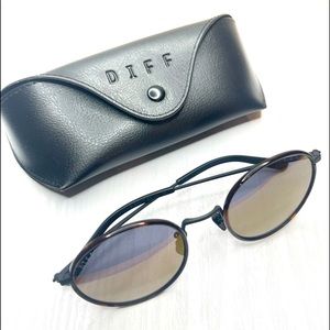 Diff eyewear Daisy round black antique + gray with gold flash polarized lenses.